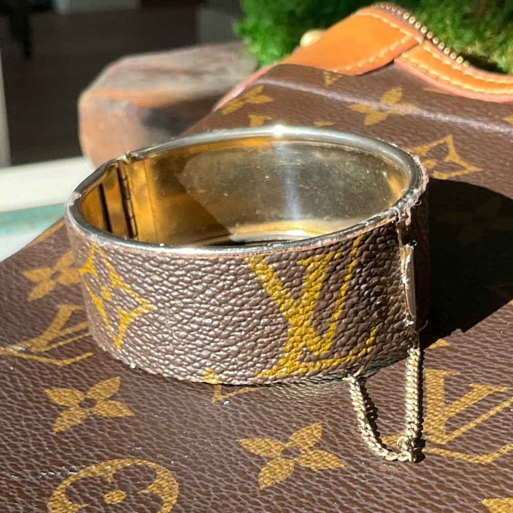 Upcycled LV wide bracelet with safety chain.